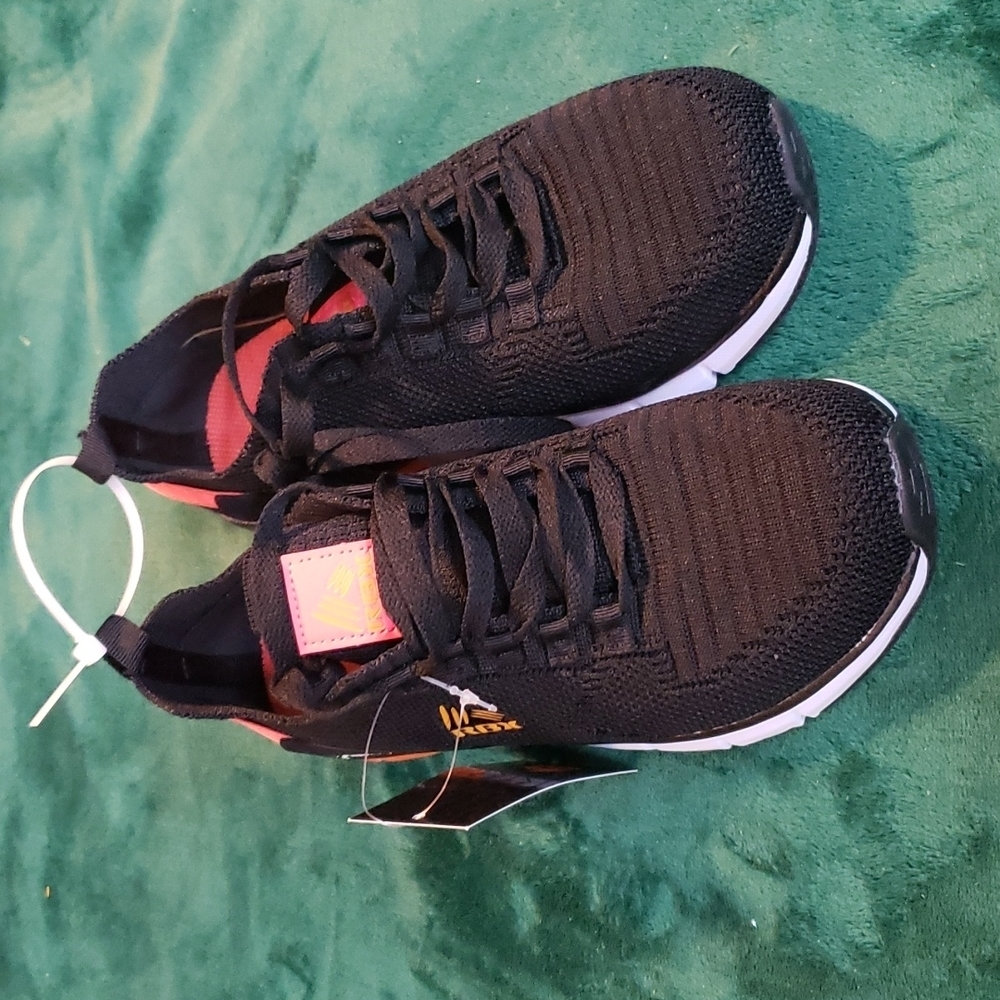 RBX black with a pop of orange Sneakers size 7
